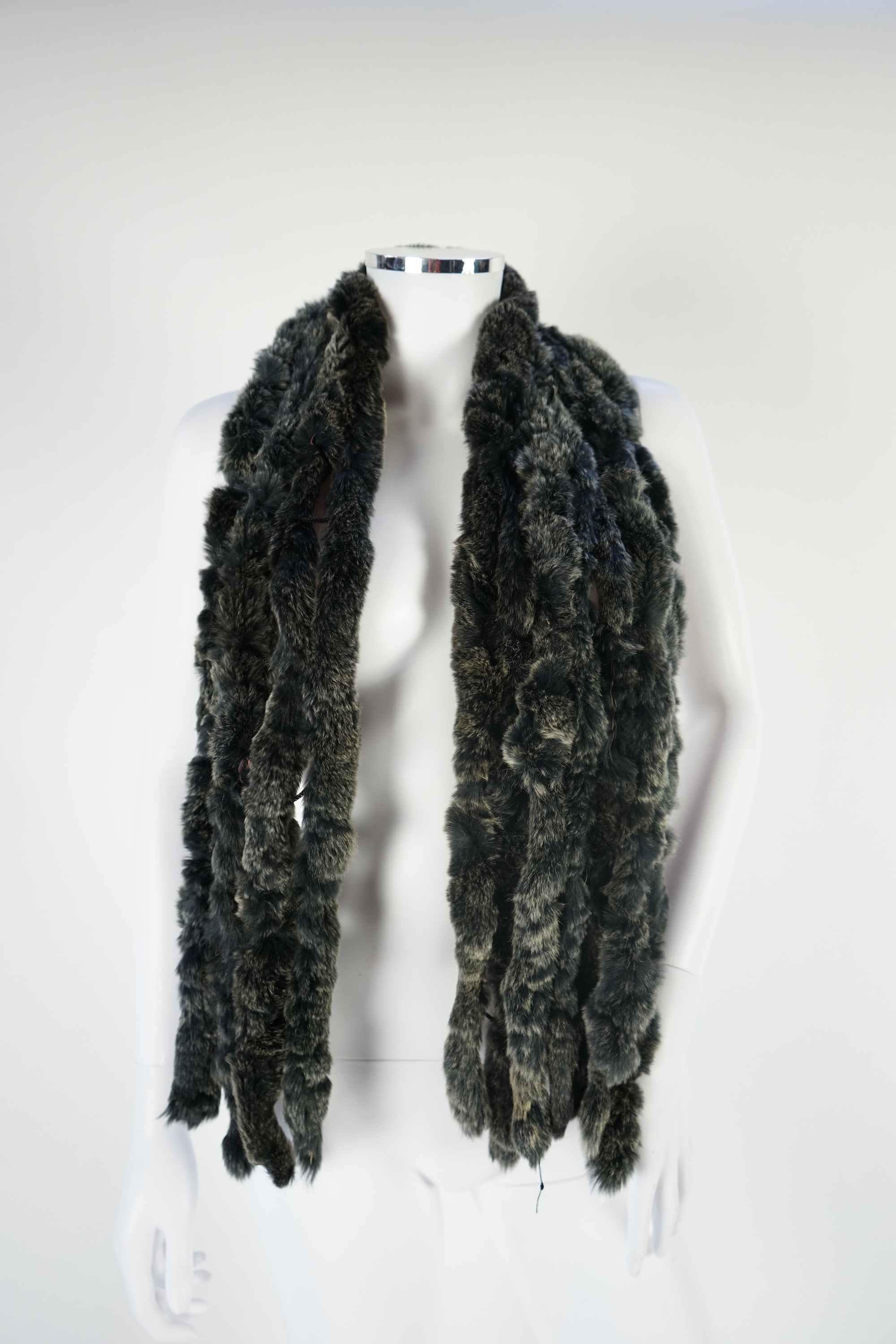 A selection of fur scarves and a fur gilet